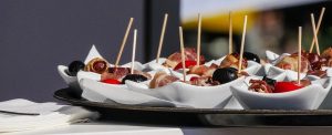 Pre-portioned event food, served in reusable ceramic bowls