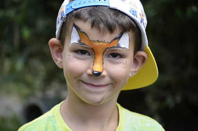 Child at school carnival with face paint