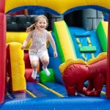 happy child jumping in bounce house