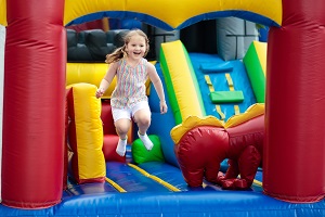 happy child jumping in bounce house