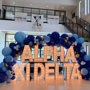 Large lighted letters alpha xi delta