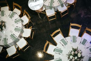 White tables and chairs at an event