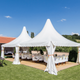 Two white tents at an event