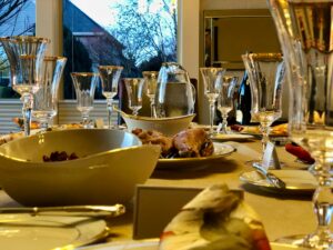 clear drinking glass beside white ceramic bowl on table