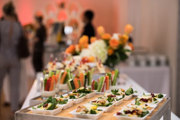Healthy organic gluten-free delicious green snacks salads on catering table during corporate event party